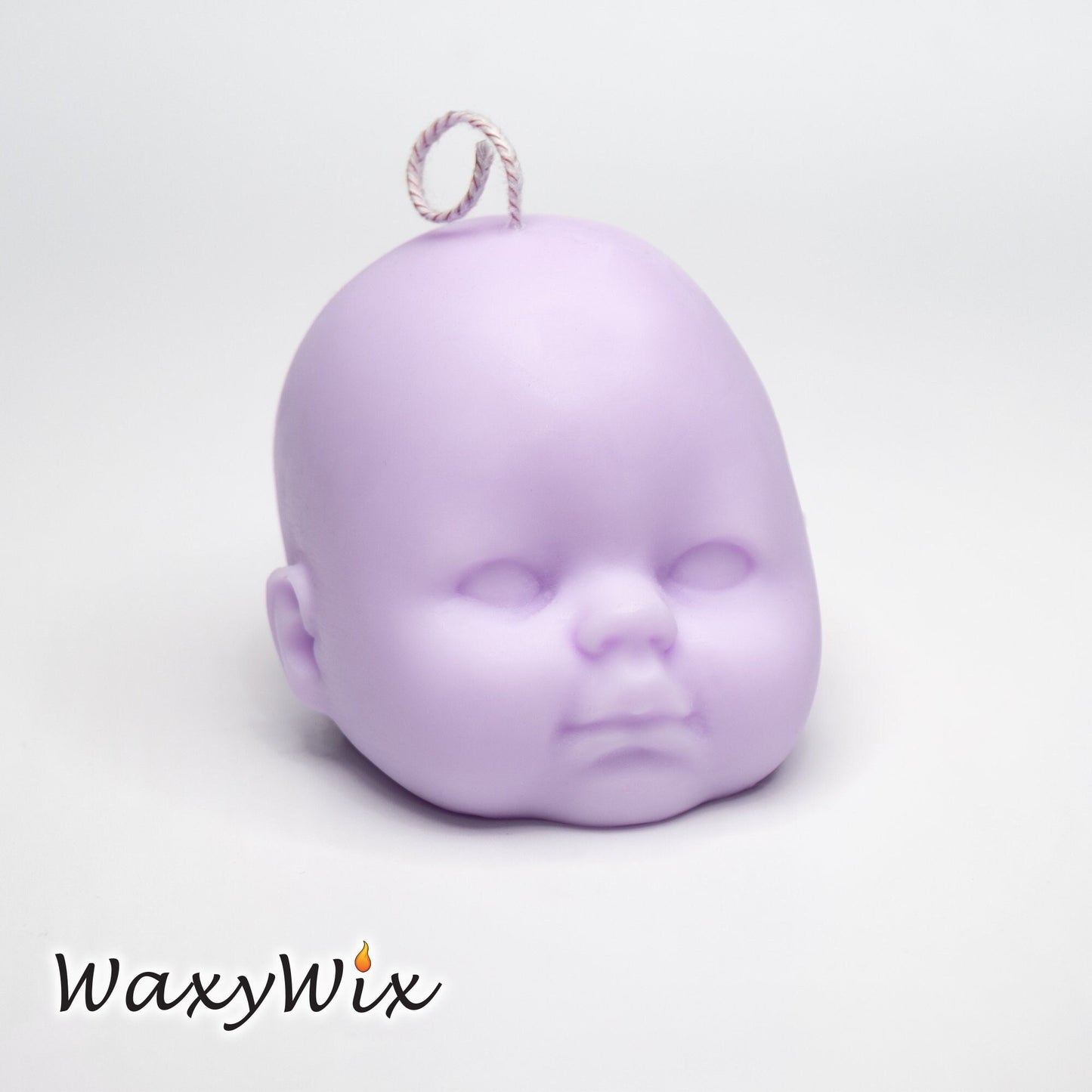 Baby head candle. Cute and Creepy.